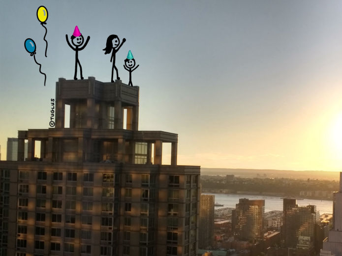Clients celebrate on top of building